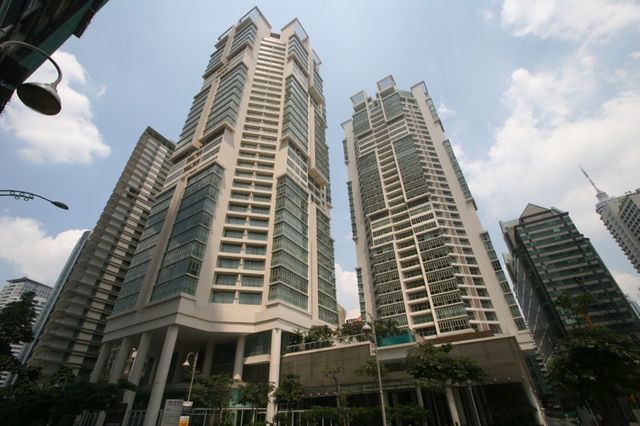 The Marc Service Residence towers from street level